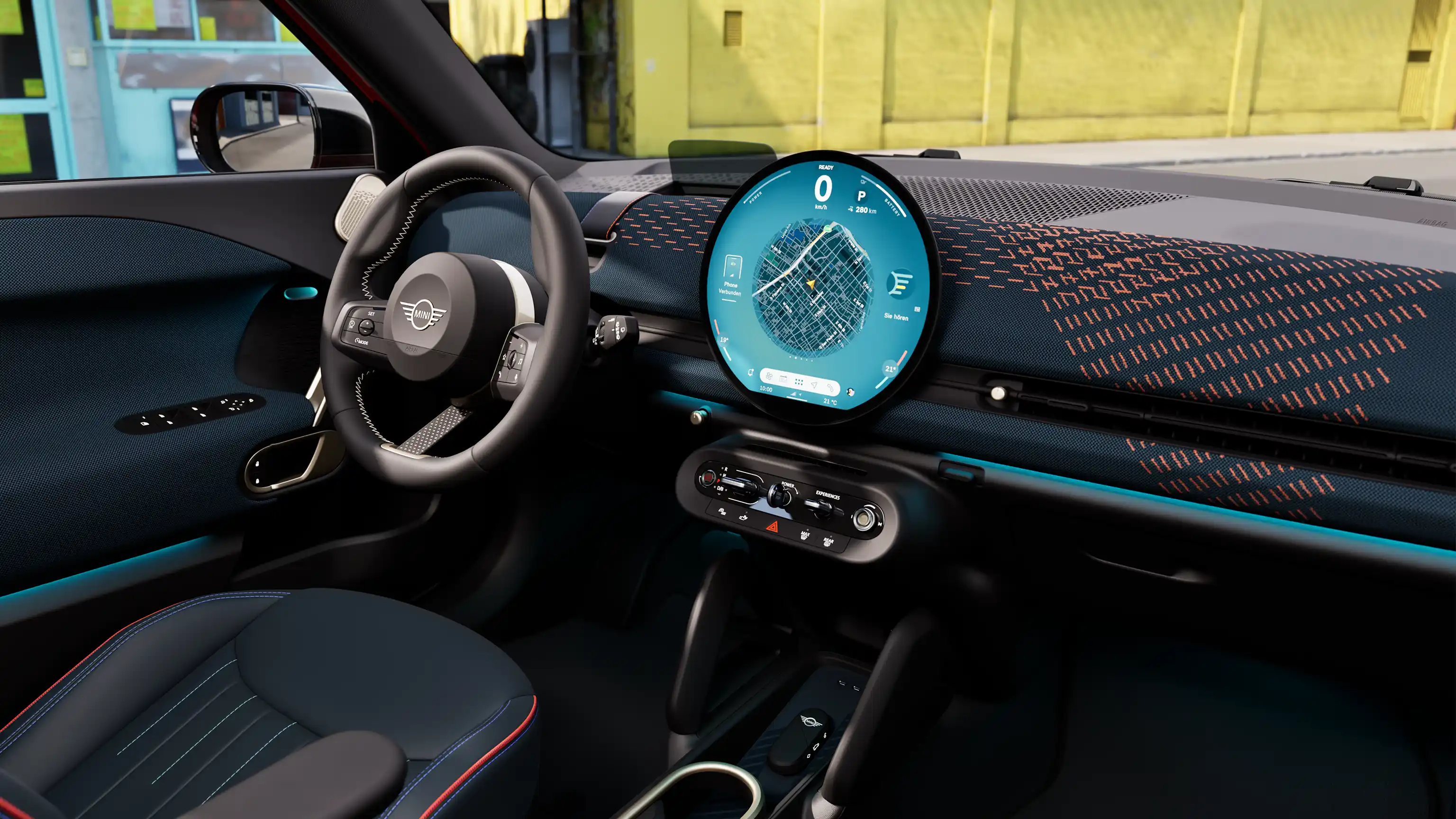 Vídeo que muestra en detalle el interior de un MINI Aceman 100 % eléctrico. La cámara recorre el interior y muestra la tapicería azul.