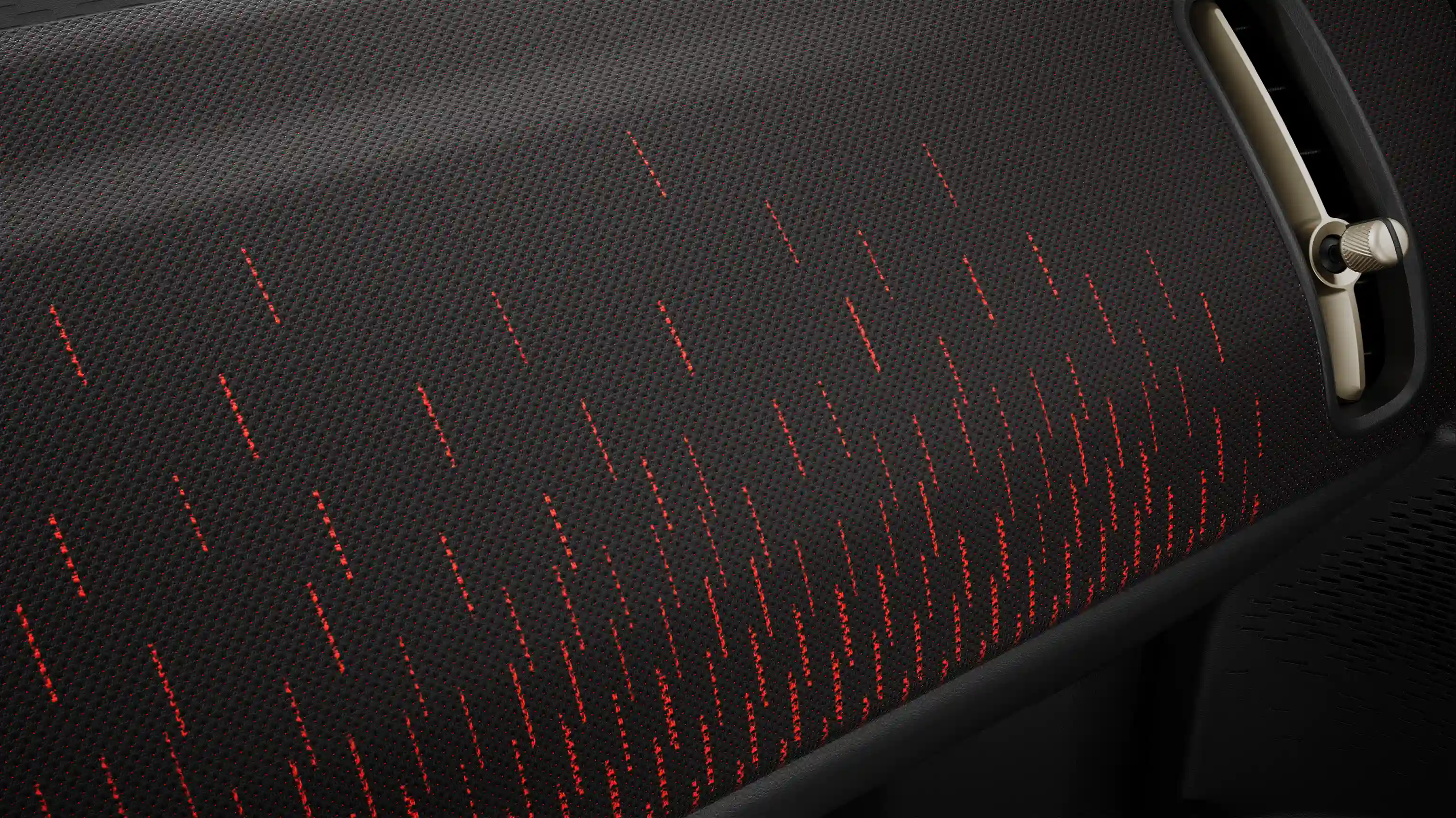 Vista del salpicadero del MINI Countryman 100% eléctrico con acabado JCW en rojo y negro