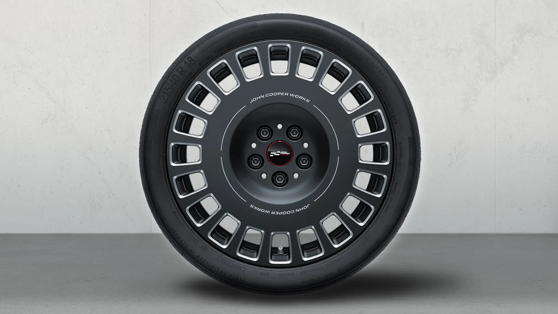 Llanta MINI JCW Rallye Spoke 964 de 18" en Frozen Midnight Grey y acabado diamantado.